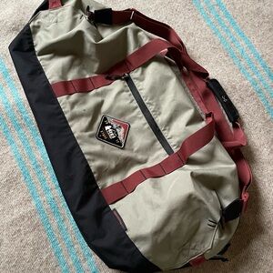 REI Road Tripper 60L gray Duffel Bag with Burgundy straps